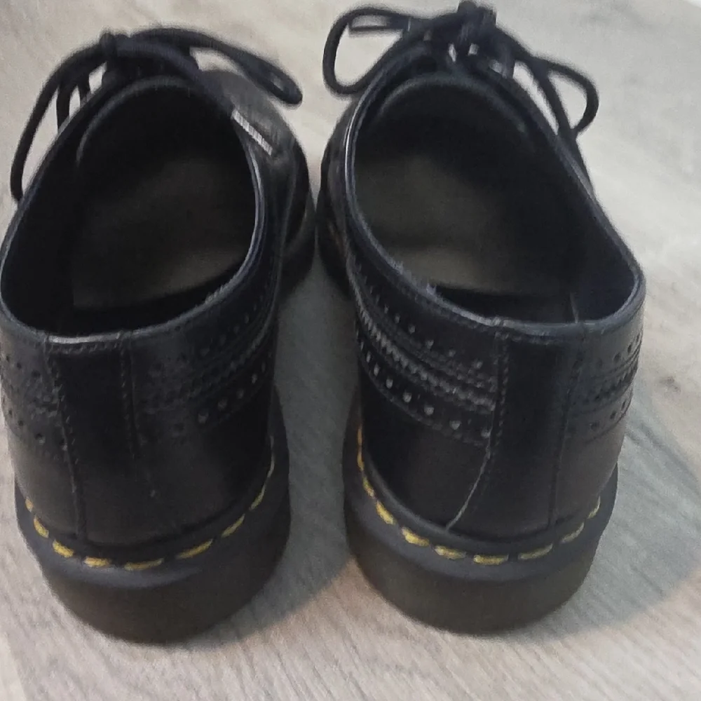 Dr. Martens Black Leather Wingtip Oxfords with Yellow Stitching